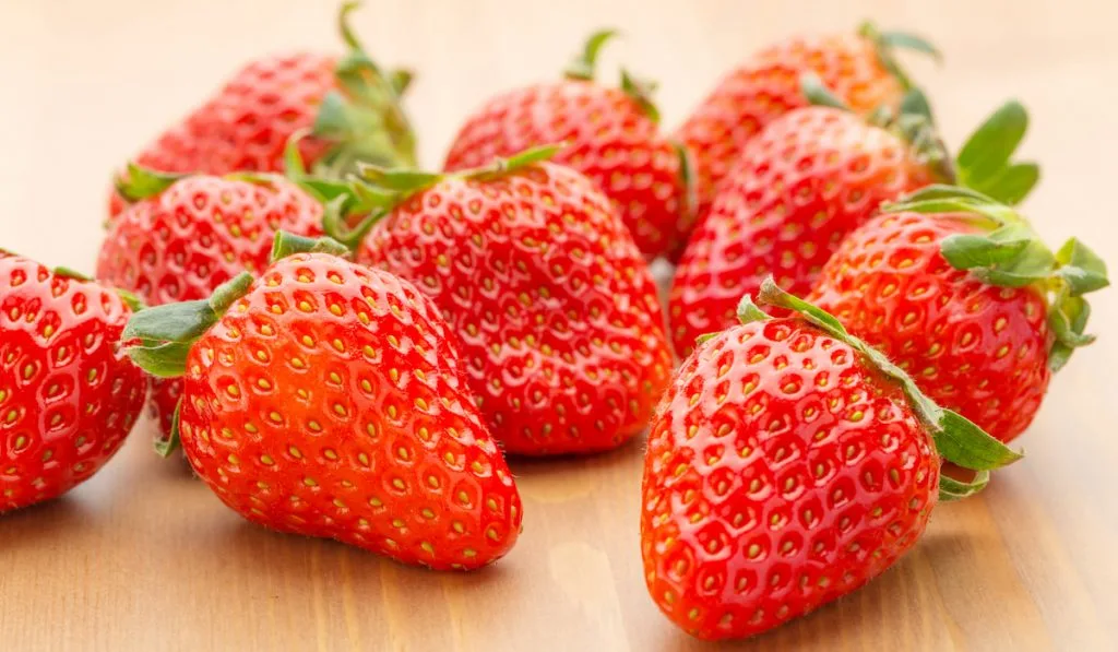 strawberries on wooden table